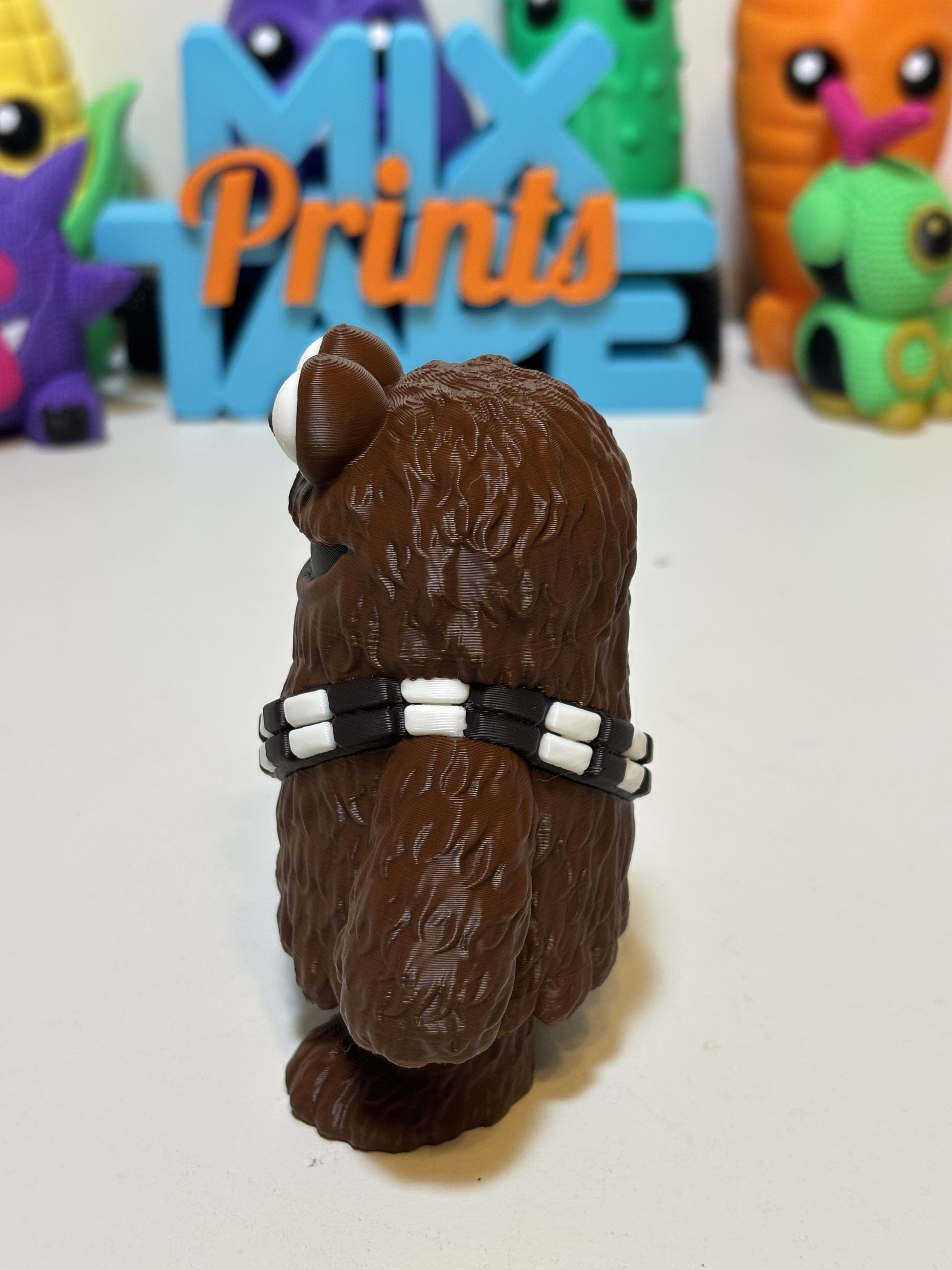 Side angle of 3D printed Wookiee Monster showing cookie accent and bandolier detail