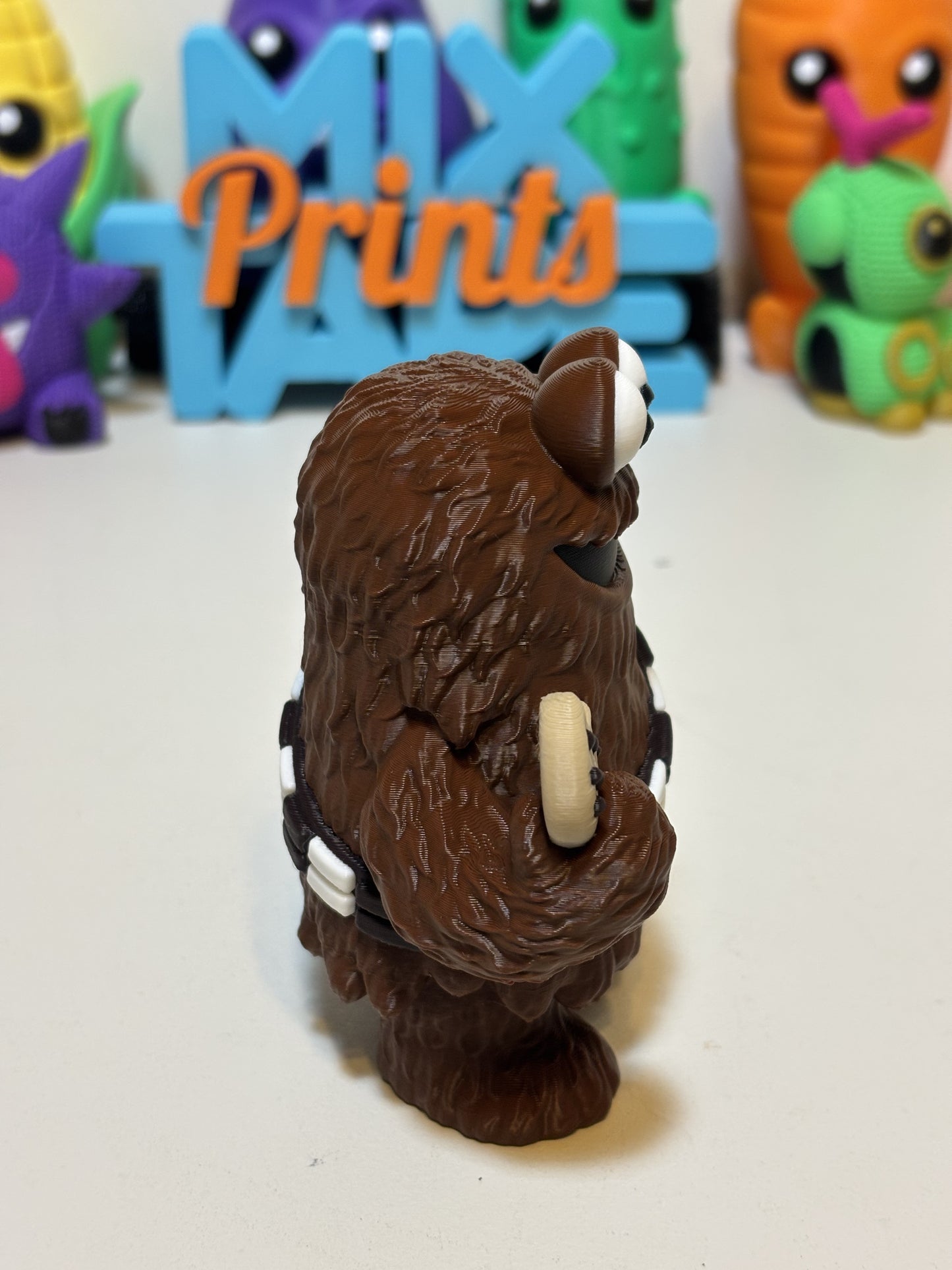 Wookiee Monster keychain in hand showing 2.5 inch size and clip attachment