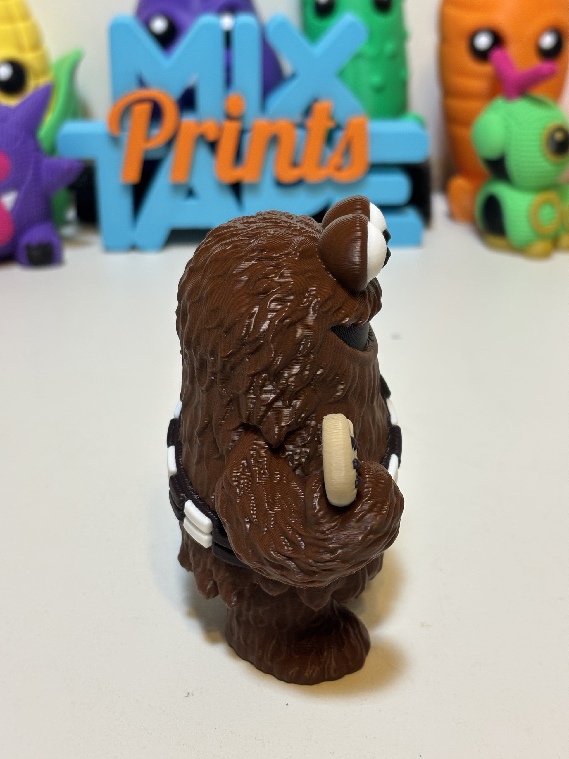 Wookiee Monster keychain in hand showing 2.5 inch size and clip attachment